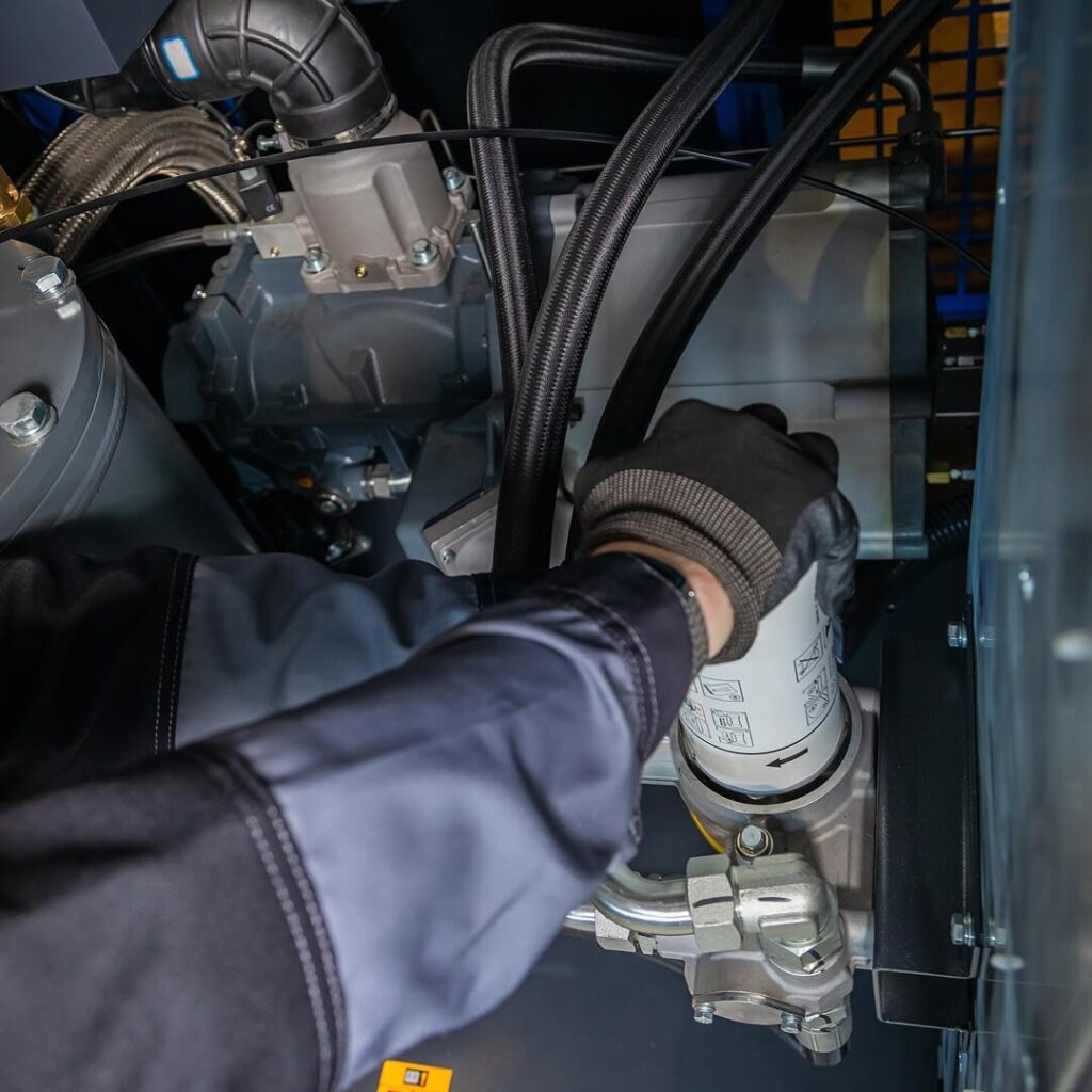 Mechanic’s hand wearing a glove